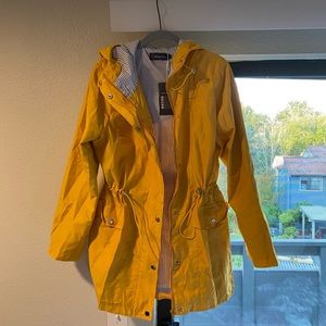 Yellow hooded raincoat with zipper, buttons & sinch waist